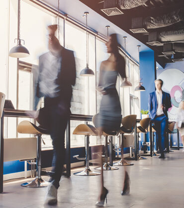 Group of young business people are working together in modern office with laptop, tablet, smart phone, notebook. Successful team in coworking. Freelancers.