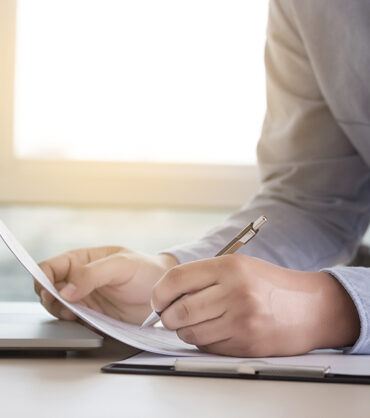 Businessman working reading documents graph financial to job succes Analyze document plans