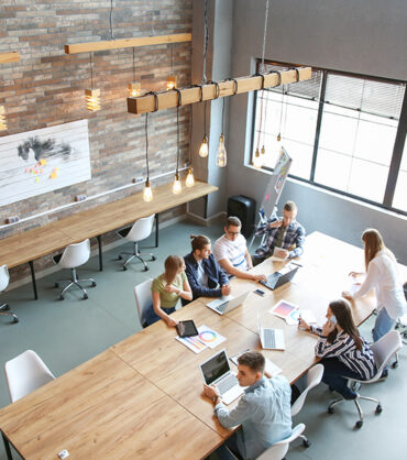 Young people having business meeting in modern office