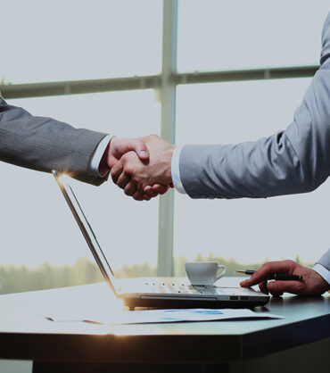 Business handshake. Morning at the office