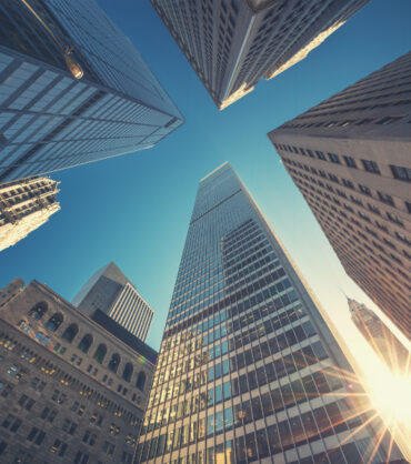 Office building top view background in retro style colors. Manhattan buildings of New York City center - Wall street