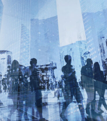 double exposure of business people walking on busy street of modern city, office buildings corporate background
