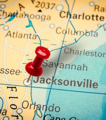 PRAGUE, CZECH REPUBLIC - JANUARY 12, 2019: Red thumbtack in a map. Pushpin pointing at Jacksonville city in Florida, America.