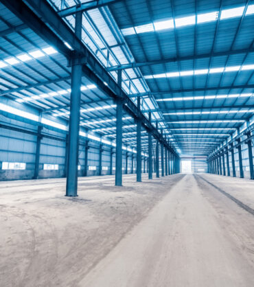 empty steel structure building, abandoned factory workshop or warehouse background